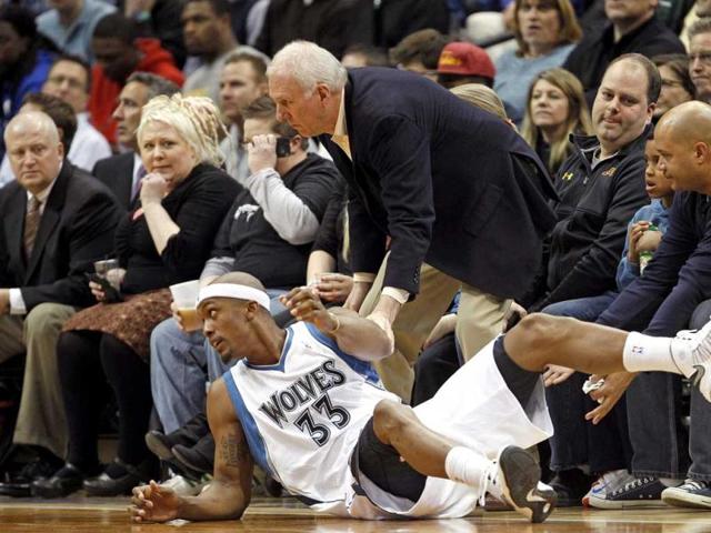 San Antonio Spurs head coach Gregg Popovich tries to keep Minnesota Timberwolves forward Dante Cunningham from sliding into him during the first half of their NBA basketball game in the Target Center in Minneapolis. Reuters photo