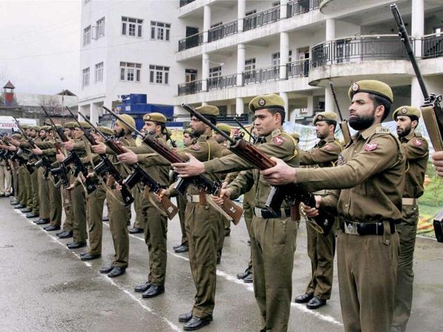 Jammu and Kashmir police personnel presenting guard of honour to the five CRPF Jawans ,who were killed during an encounter with militants at Bemina, during a wreath laying ceremony, at DPL in Srinagar. PTI Photo