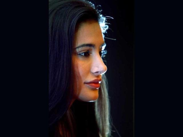 American born model and Bollywood actress Nargis Fakhri attends a promotional event in Bangalore, Thursday, March 14, 2013. AP Photo