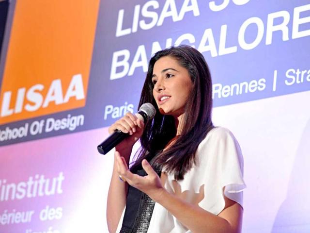 US fashion model and Bollywood actress Nargis Fakhri speaks during the launch of the LISAA School of Design in Bangalore on March 14, 2013. LISAA is a Paris based French institute of design offering courses in architecture, design, graphics and fashion. AFP Photo