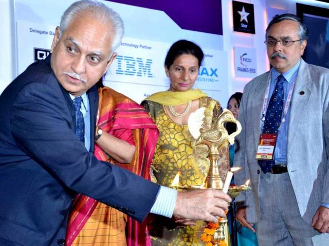 Co-Chairperson FICCI Media & Entertainment Committee Ramesh Sippy lighting the lamp FICCI Frames 2013 in presence of Naina Lal Kidwai, President-FICCI, Uday Shankar, Chairman, FICCI Media & Entertainement Committee, Preneet Kaur, Union Minister of State for External Affairs & Karan Johar, Co Chair, FICCI Frames in Mumbai on Tuesday. (UNI Photo)