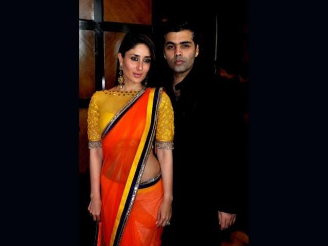 Kareena Kapoor looked lime fresh in a bright orange and yellow sari as she posed with Karan Johar at the FICCI Frames 2013 annual conclave held in Mumbai (AFP Photo)