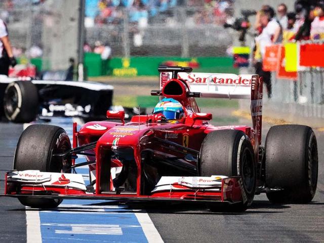 Fernando Alonso of Spain steers his car in the pit lane during the first practice session for Sunday's Australian Formula One Grand Prix at Albert Park in Melbourne, Australia. (AP Photo)