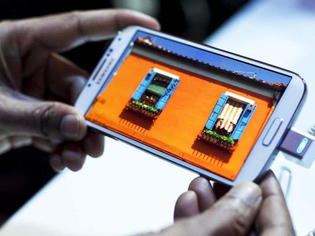 Samsung, the world's largest handset maker, revealed their successor to the Galaxy S III, the Galaxy S IV. (AFP Photo)