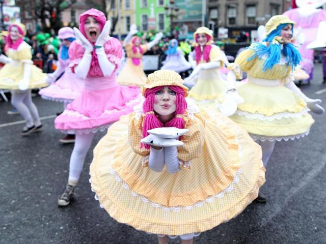 Revellers perform on the parade route during St Patrick's Day festivities in Dublin. (AFP)
