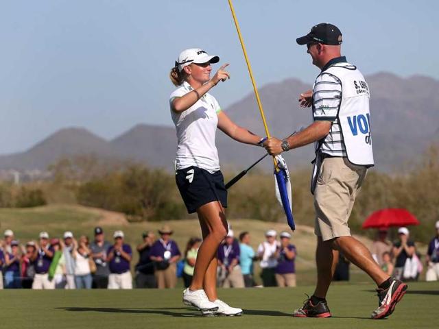 Stacy Lewis hugs her caddie Travis Wilson after winning the RR Donnelley LPGA Founders Cup at Wildfire Golf Club in Phoenix, Arizona. AFP/Christian Petersen/Getty Images