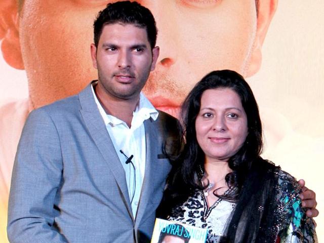 Cricketer Yuvraj Singh with mother Shabnam during his book launch in New Delhi. PTI Photo by Vijay Verma