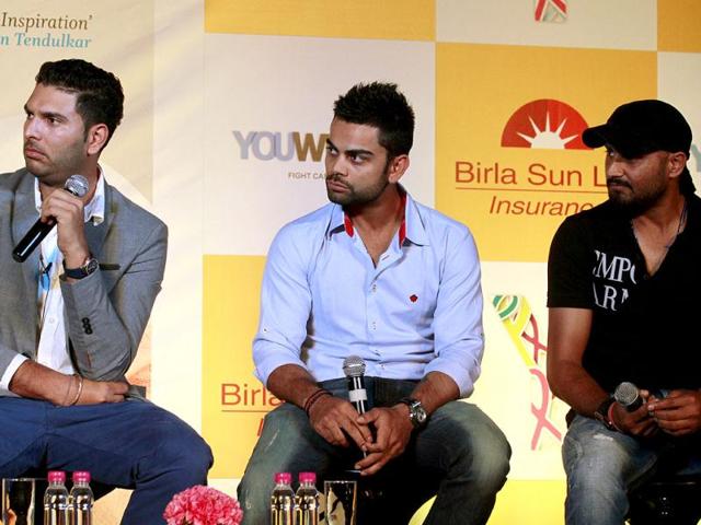 Cricketers Virat Kohli and Harbhajan Singh at the book launch of Yuvraj Singh in New Delhi. Photo by Virendra Singh Gosain/Hindustan Times