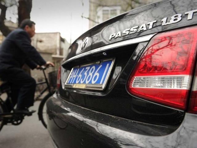 A-cyclist-passes-a-Volkswagen-Passat-parked-on-a-street-in-Shanghai-on-March-20-2013-Volkswagen-said-it-would-recall-384-181-vehicles-in-China-over-gearbox-defects-marking-the-German-auto-giant-s-biggest-ever-recall-in-the-world-s-largest-auto-market-Photo-AFP A-cyclist-passes-a-Volkswagen-Passat-parked-on-a-street-in-Shanghai-on-March-20-2013-Volkswagen-said-it-would-recall-384-181-vehicles-in-China-over-gearbox-defects-marking-the-German-auto-giant-s-biggest-ever-recall-in-the-world-s-largest-auto-market-Photo-AFP