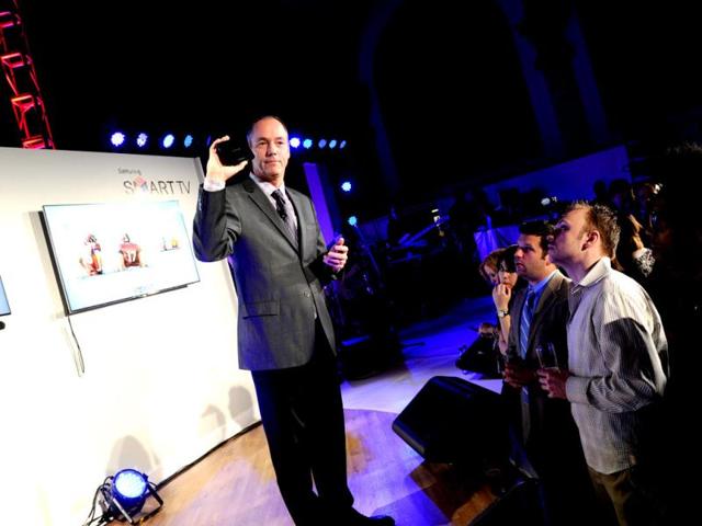 Tim Baxter, president of Samsung Electronics America, demonstrates features of the 2013 line of Smart TVs in New York. (AP/Invision for Samsung)