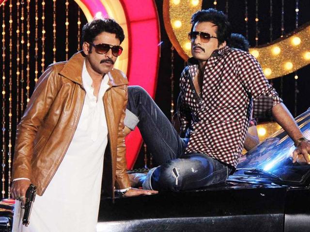 Manoj Bajpai and Sonu Sood perform during the music launch for Shootout At Wadala in Mumbai. (AFP Photo)