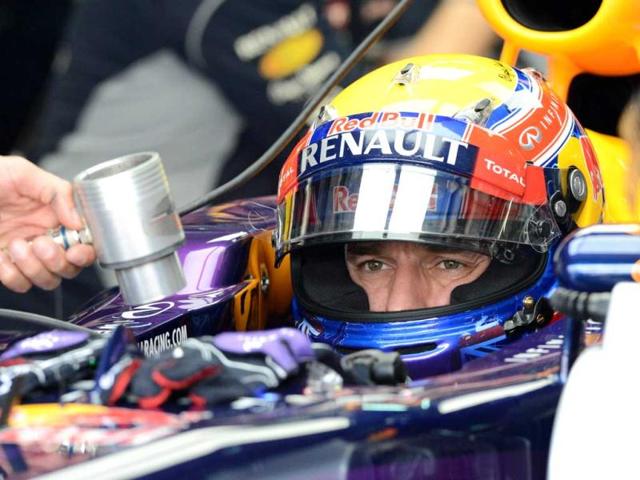 Red-Bull-driver-Mark-Webber-of-Australia-sits-in-his-the-race-car-during-the-first-practice-session-of-the-Formula-One-Malaysian-Grand-Prix-at-Sepang-AFP-photo