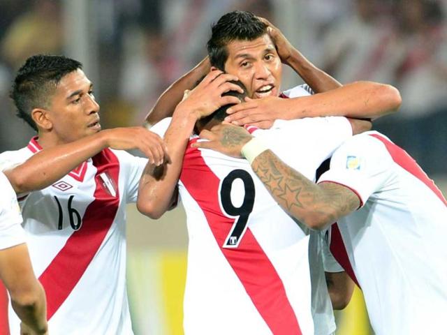 Peruvian forward Jefferson Farfan celebrates with teammates after scoring against Chile during their FIFA World Cup Brazil 2014 South American qualifying football match in Lima, Peru. (AFP)