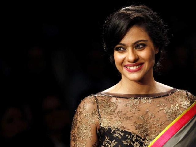 Kajol looks stunning in this new avatar as she showcases a creation by designer Manish Malhotra during a fashion show on the first day of Lakme Fashion Week. (AP Photo)