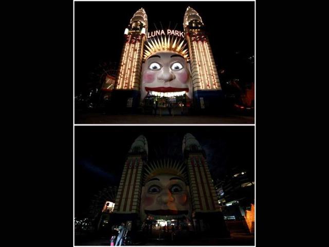 A combination picture shows the entrance to the Sydney amusement park "Luna Park" on (top) before Earth Hour, and during Earth. Reuters