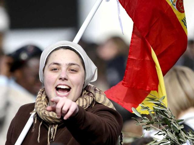 A Spanish nun shouts during the Palm Sunday mass led by Pope Francis at Saint Peter's Square at the Vatican. Reuters