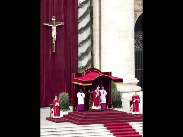 Pope Francis leads the faithful in his first Palm Sunday celebration at the Vatican. AP