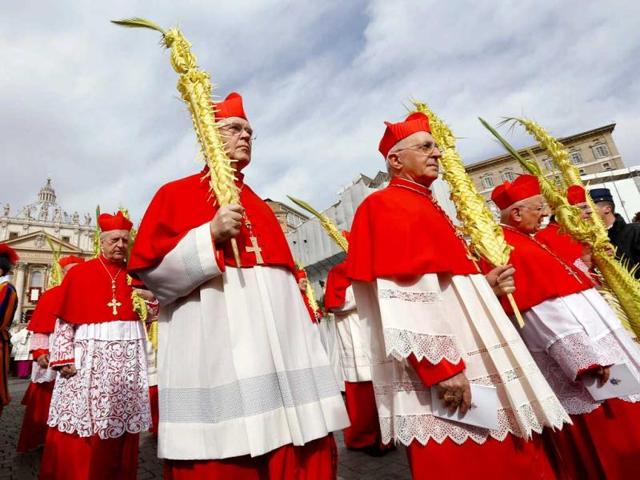 Cardinals hold palm fronds during the Palm Sunday mass led by Pope Francis at Saint Peter's Square at the Vatican. Reuters
