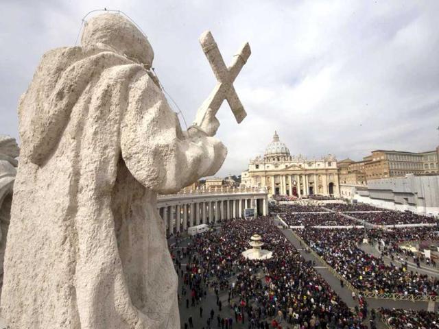 The faithful gather in St. Peter's Square at the Vatican on Palm Sunday. AP
