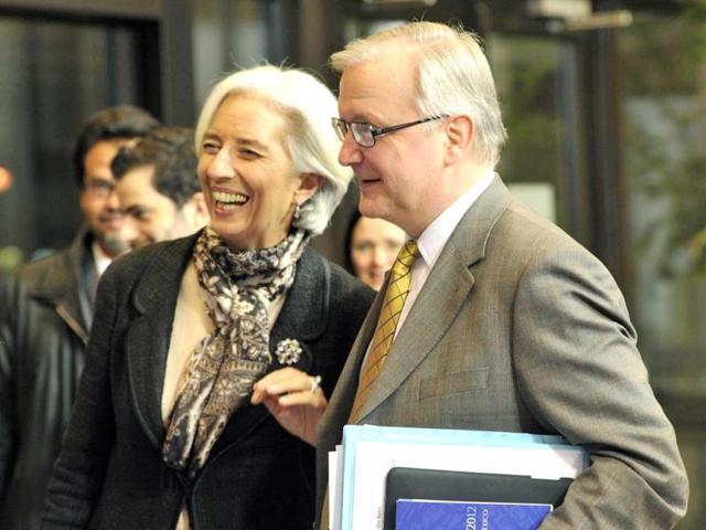 EU commissioner for economic and monetary affairs Olli Rehn (R) and International Monetary Fund (IMF) managing director Christine Lagarde (L) leave following a Eurozone meeting at EU headquarters in Brussels. AFP photo
