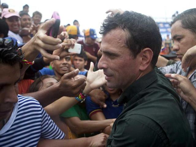 Venezuela's opposition candidate Henrique Capriles greets supporters during a campaign rally in San Felipe, in the state of Yaracuy. Reuters