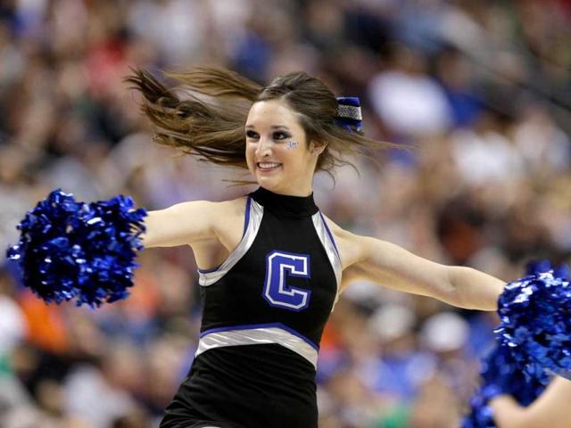 A Creighton Bluejays cheerleader performs while taking on the Duke Blue Devils during the third round of the 2013 NCAA Men's Basketball Tournament at Wells Fargo Center in Philadelphia, Pennsylvania. AFP