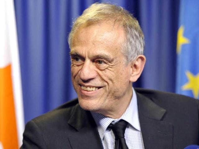 Cyprus's finance minister Michalis Sarris takes part in a press conference following a Eurozone meeting at EU headquarters in Brussels. EU and IMF officials struck a last-minute deal with Cyprus early resurrect a bailout for the island. AFP photo