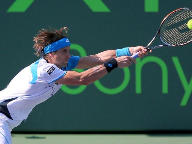 David Ferrer of Spain returns to Austria's Jurgen Melzer during their match at the Sony Open tennis tournament in Key Biscayne, Fla. (AP Photo/El Nuevo Herald)