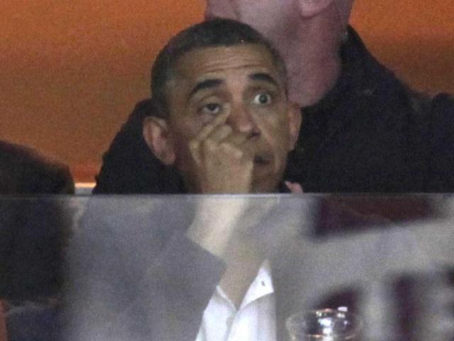 President Obama watches NCAA basketball game in Washington. (Reuters)