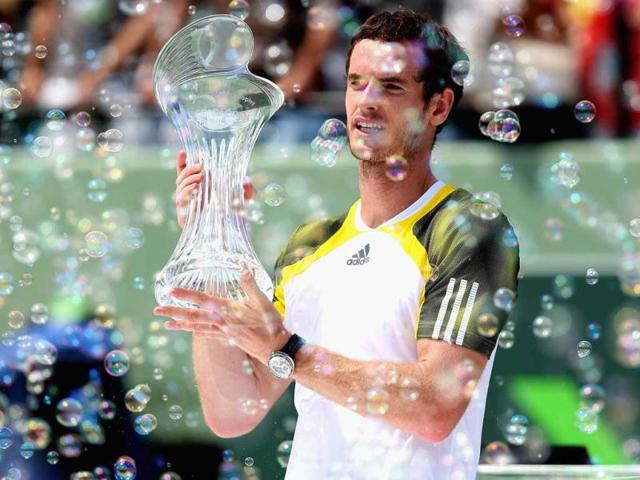 Andy Murray holds aloft the trophy after his three set victory against David Ferrer during their final match at the Sony Open at Crandon Park Tennis Center in Key Biscayne, Florida. (AFP)