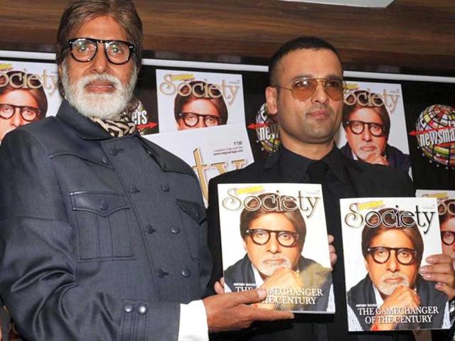 Amitabh Bachchan with TV actor Rohit Roy during the unveiling of the Society magazine cover, in Mumbai on Saturday night. (UNI Photo)
