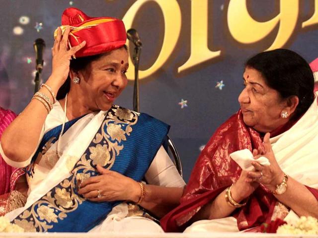 Asha Bhosle and Lata Mangeshwar present for the Hiryday nath Mangeshkar awards to present, wherein Lata Mangeshkar gave away the award to her sister Asha Bhosle at Ville Parle in Mumbai, {contry}, on Sunday, March 31, 2013. (Photo by Vidya Subramanian/Hindustan Times) Asha Bhosle and Lata Mangeshwar present for the Hiryday nath Mangeshkar awards to present, wherein Lata Mangeshkar gave away the award to her sister Asha Bhosle at Ville Parle in Mumbai, {contry}, on Sunday, March 31, 2013. (Photo by Vidya Subramanian/Hindustan Times)