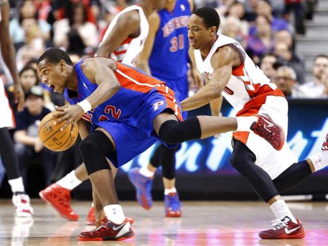 Detroit Piston's Khris Middleton goes to the basket against Toronto Raptors' DeMar DeRozan during the second half of their NBA basketball game in Toronto. Reuters