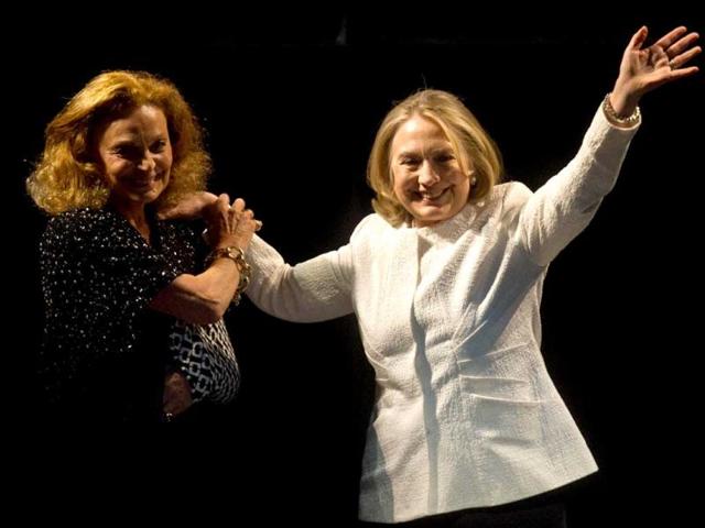 Former US Secretary of State Hillary Clinton is greeted on stage by fashion designer Diane von Furstenberg before addressing the Vital Voices Global Awards ceremony at the Kennedy Center in Washington. (AFP)