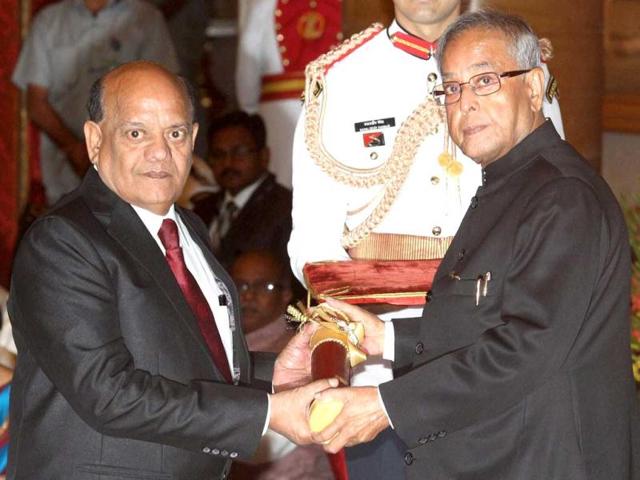 President Pranab Mukherjee presents Padma Shri to Surendra Sharma at Padma Awards 2013 at the Rashtrapati Bhavan in New Delhi on Friday. (PTI Photo)
