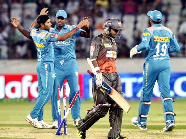 Sunrisers Hyderabad's Parthiv Patel walks off the field as Pune Warriors players celebrate his dismissal during the IPL 6 T20 match in Hyderabad. PTI