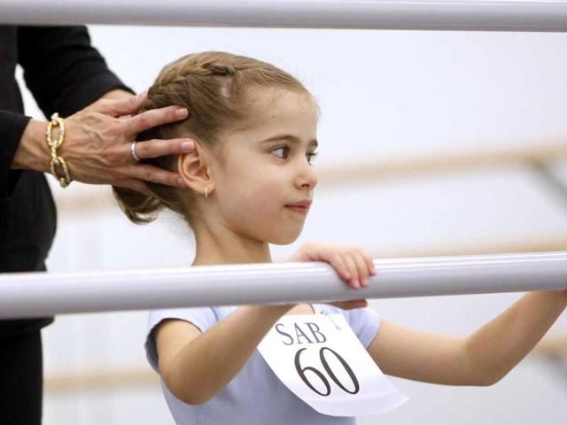 Kyra Neamonitakis, 5, of the Brooklyn borough of New York, is evaluated during an audition for six-year old ballet hopefuls at the School of American Ballet in New York. AP Photo