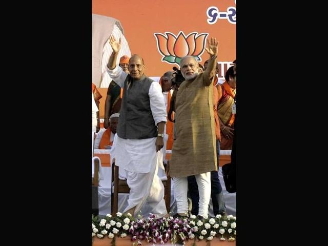 Gujarat-chief-minister-Narendra-Modi-waves-to-supporters-during-the-BJP-s-foundation-day-celebration-in-Ahmadabad-UNI