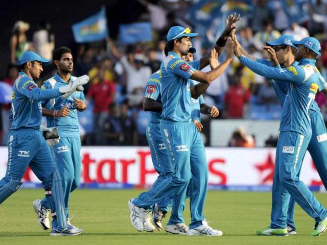Pune Warriors India fielders celebrate the wicket of Kings XI Punjab batsman Adam Gilchrist during the Pepsi IPL T20 cricket match at the Subrata Roy Sahara Stadium.in Pune. HT Photo/Vijayanand Gupta