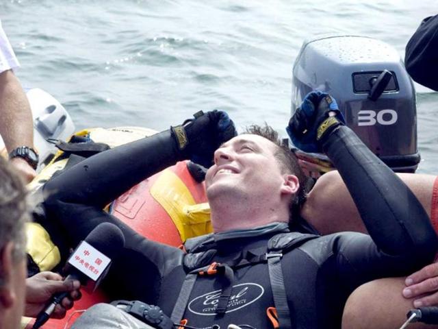 Matt Silver-Vallance reacts after he flew acrosse the sea from Nelson Mandela's apartheid island prison using helium-filled giant party balloons in Cape Town. AFP