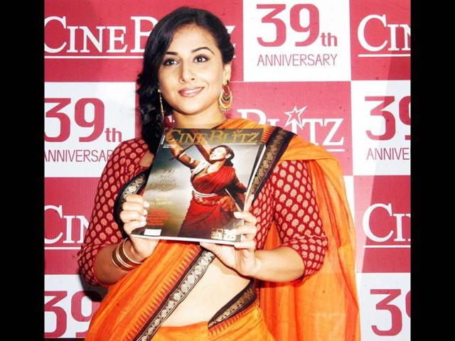 Vidya Balan poses with the magazine during the event. UNI Photo