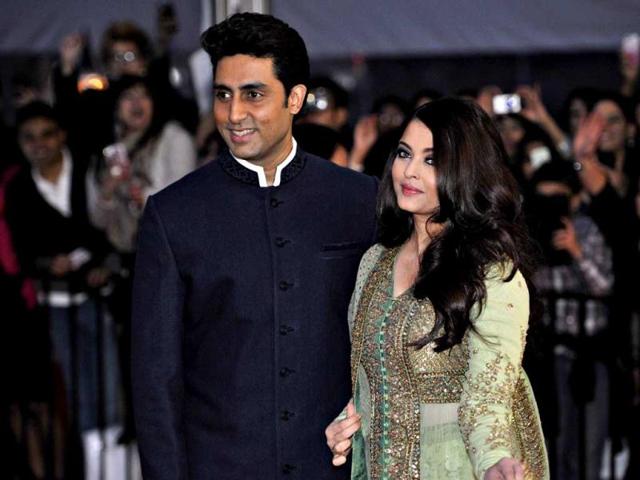 Abhishek Bachchan arrives with his wife Aishwarya Rai for an award ceremony in Vancouver, on April 6, 2013. (Reuters Photo)