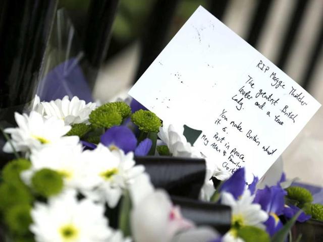 A note and floral tribute is seen after it was placed outside the home of former British prime minister Margaret Thatcher after her death was announced in London. Margaret Thatcher, the "Iron Lady" who dominated British politics for two decades, died following a stroke, a spokesman for her family said. Reuters