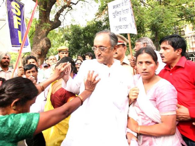 West Bengal finance minister Amit Mitra was heckled and had his shirt torn off by Students Federation of India activists outside the planning commission in New Delhi. HT