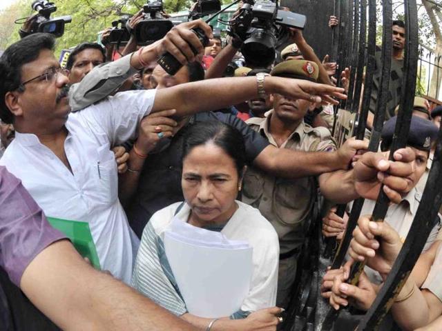 West Bengal chief minister Mamata Banerjee being escorted to planning commission office to attend the meeting with Montek Singh Ahluwalia for finalising the annual plan of the state in New Delhi. UNI