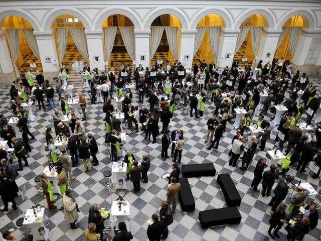 Graves region wineyard owners and professionals in the wine sector taste the 2012 production in the hall of the Bordeaux stock exchange during the opening of the week of primeur in the southwestern French region. AFP