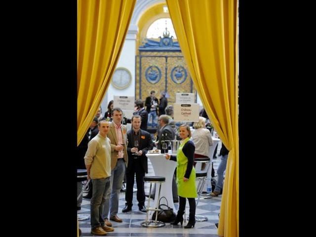 The owners of a wineyard in the Graves region of Bordeaux taste with professionals in the wine sector their 2012 production in the hall of the Bordeaux stock exchange during the opening of the week of primeur in the southwestern French region. AFP