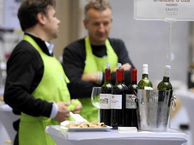 Wine producers propose their 2012 Bordeaux production for tasting in the hall of the Bordeaux stock exchange during the opening of the week of primeur in the southwestern French region. AFP