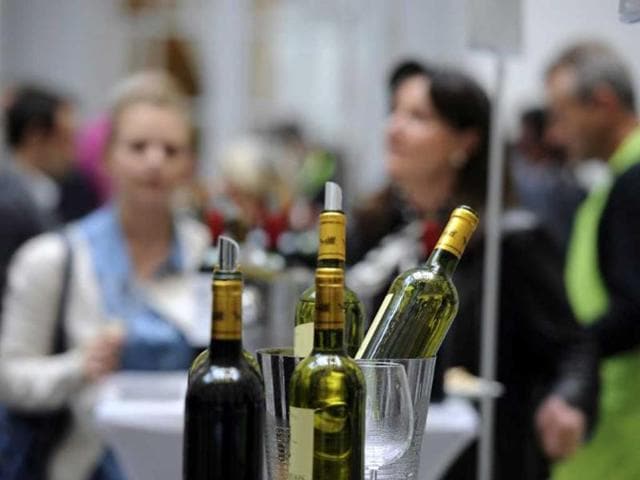 Bottles of the 2012 Bordeaux production are opened for tasting in the hall of the Bordeaux stock exchange during the opening of the week of primeur in the southwestern French region. AFP