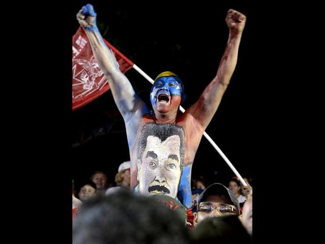 Supporters of Venezuelan acting president Nicolas Maduro cheer during a rally in Barquisimeto. AFP PHOTO/JUAN BARRETO